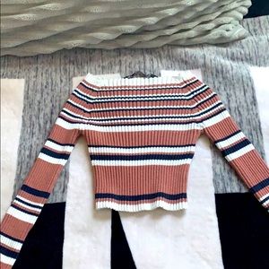 This is an off the shoulder cropped shirt